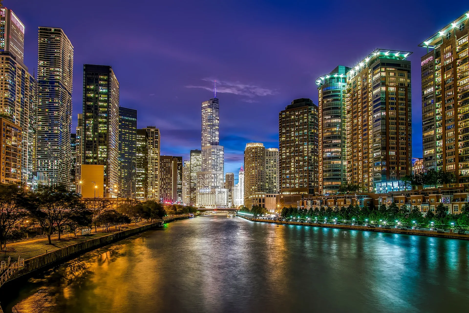The Chicago skyline and riverfront lit up at dusk